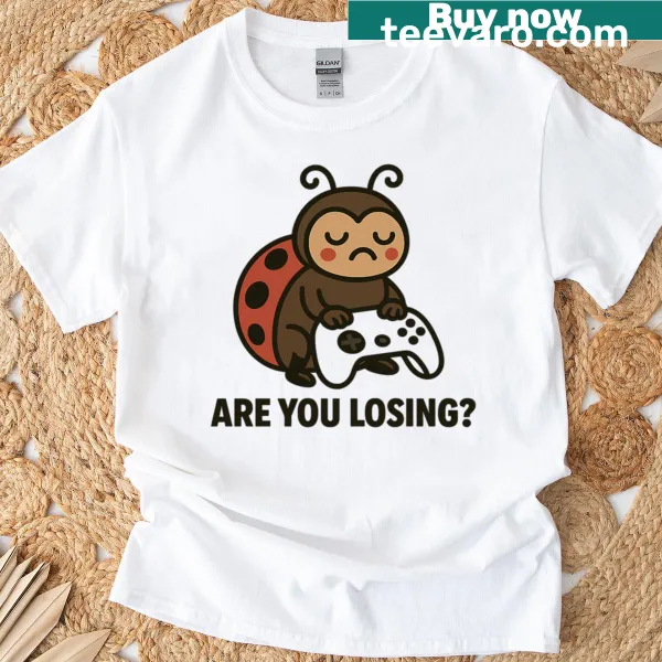 Humorous meme t-shirt featuring a ladybug with a gaming controller