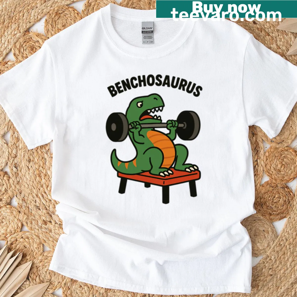 Cartoon dinosaur lifting weights on a t-shirt — on a men's t-shirt