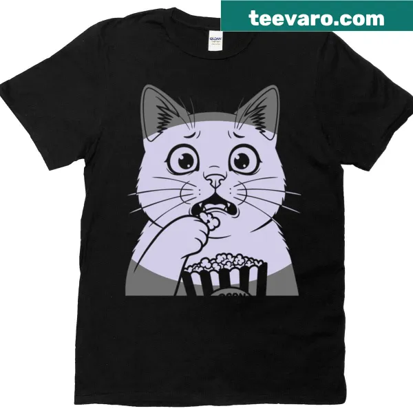 Illustrated T-shirt featuring a cat watching horror movies with popcorn