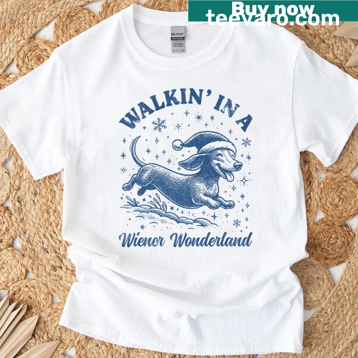 Funny Christmas t-shirt featuring dachshunds in a winter wonderland — on a men's t-shirt