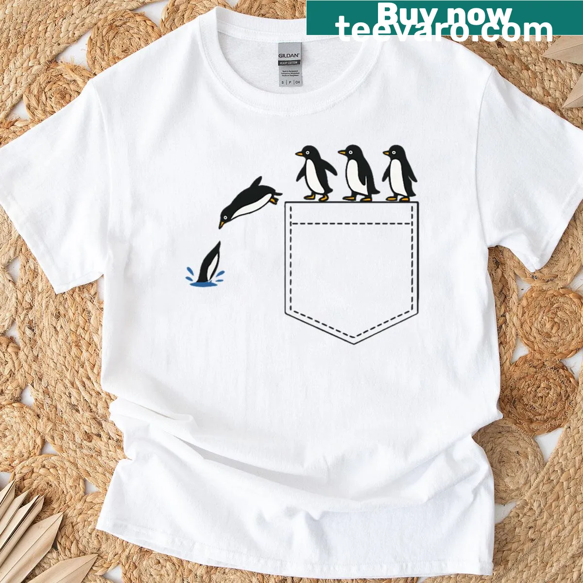 Cute diving penguin graphic on pocket T-shirt — on a men's t-shirt