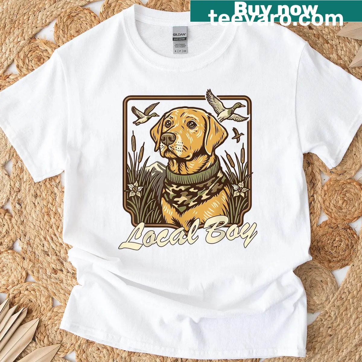 Vintage t-shirt featuring a yellow lab hunting in a sunset marsh scene — on a men's t-shirt