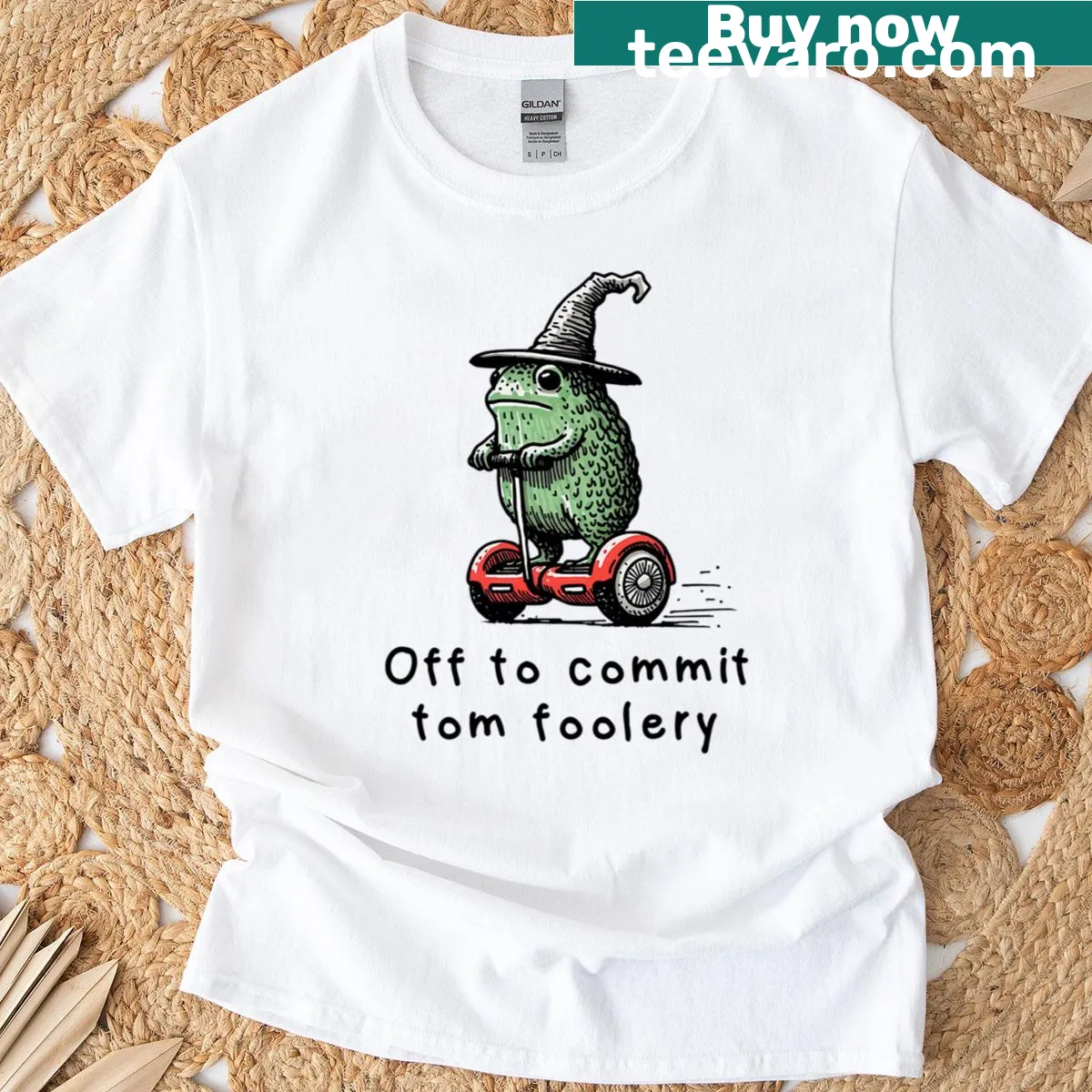 Whimsical t-shirt featuring a wizard frog illustration — on a men's t-shirt