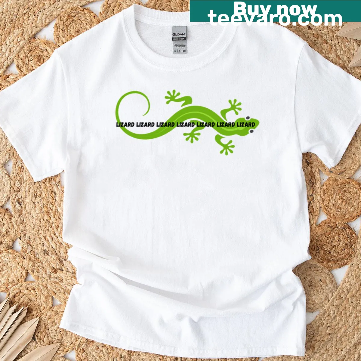 T-shirt featuring a playful illustration of a repetitive green reptile. — on a men's t-shirt