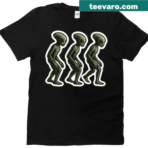 Premium t-shirt with a playful graphic of three walking green aliens.