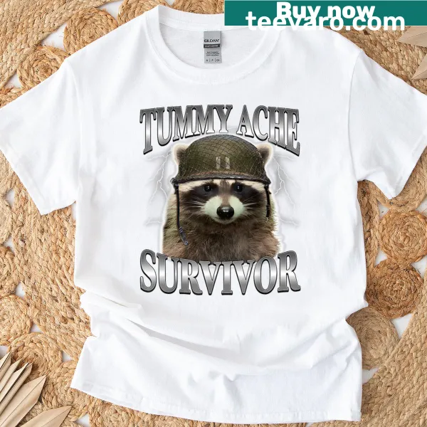 Funny cat meme T-shirt featuring a raccoon and the text 'Tummy Ache Survivor'