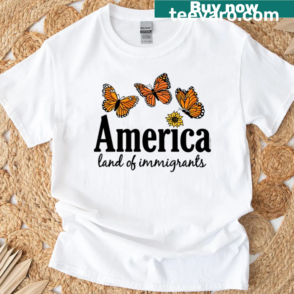 T-shirt with America Land Of Immigrants typography graphic — on a men's t-shirt