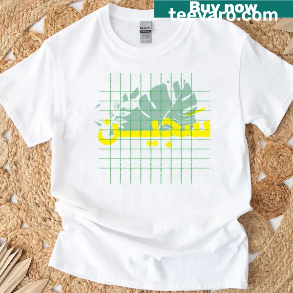 Artistic Arabic typography with tropical leaves and grid design on t-shirt