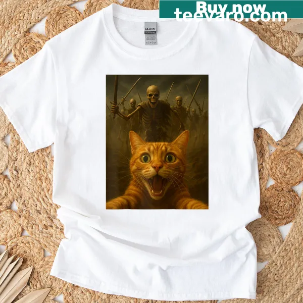 Costume-themed raglan tee featuring a humorous orange cat and skeletons for Halloween