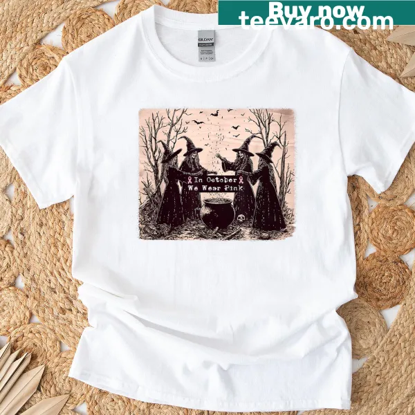 Halloween-themed T-shirt with pink ribbon and witch graphics for breast cancer awareness.