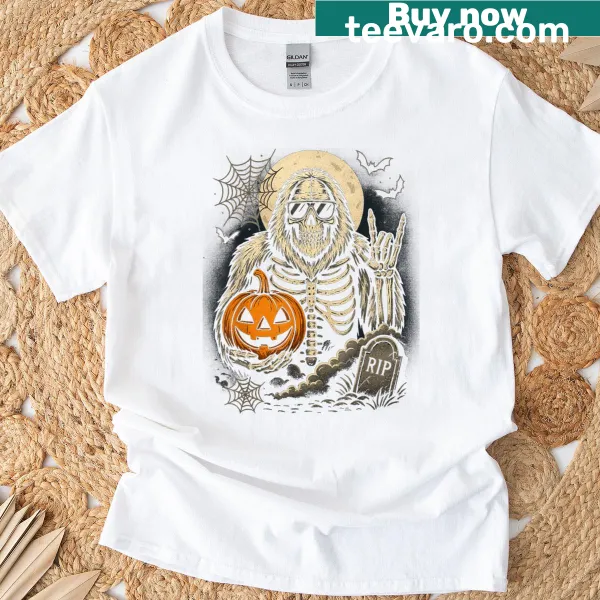 Cartoon Sasquatch among pumpkins and skeletons on kids t-shirt