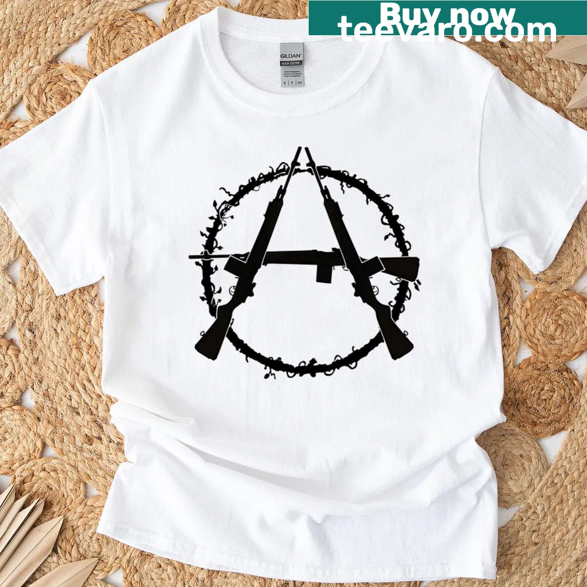Graphic tee featuring M-14 rifle and anarchist symbols — on a men's t-shirt