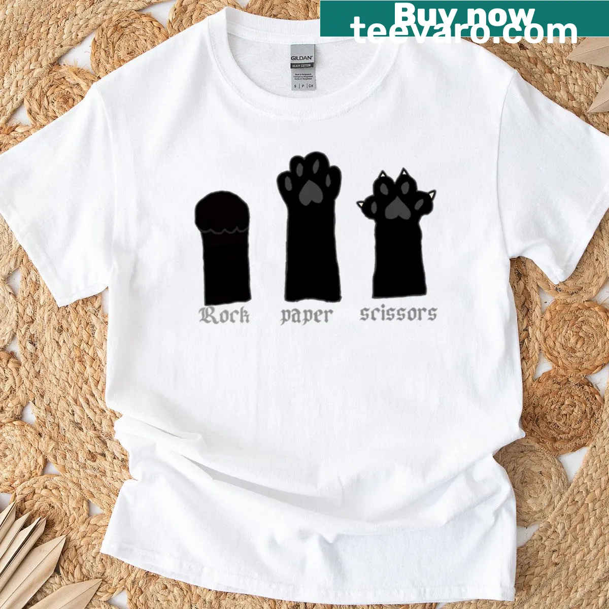 Black cat paw prints graphic on T-shirt — on a men's t-shirt