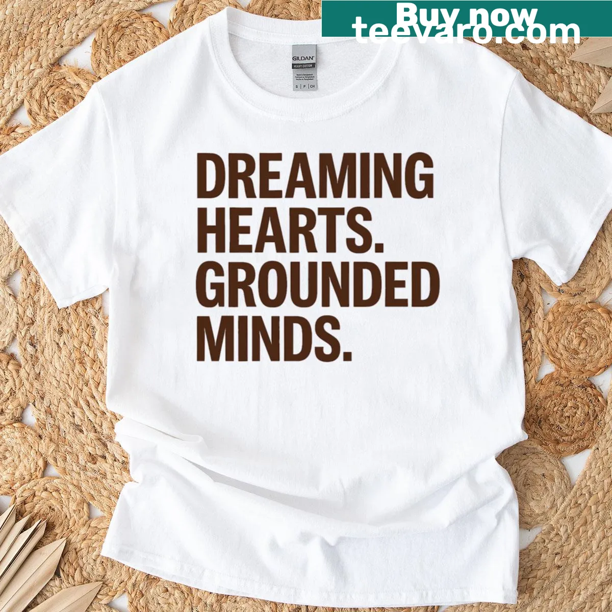 Typographic t-shirt with the phrase 'Dreaming Hearts Grounded Minds'. — on a men's t-shirt