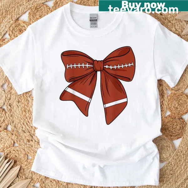 Illustrative t-shirt with a cute bow and football graphics.