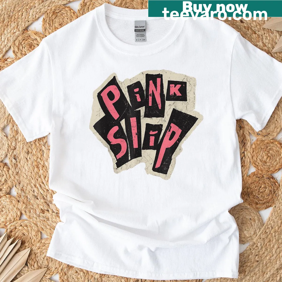 Distressed grunge typography design on a pink T-shirt for an edgy look — on a men's t-shirt