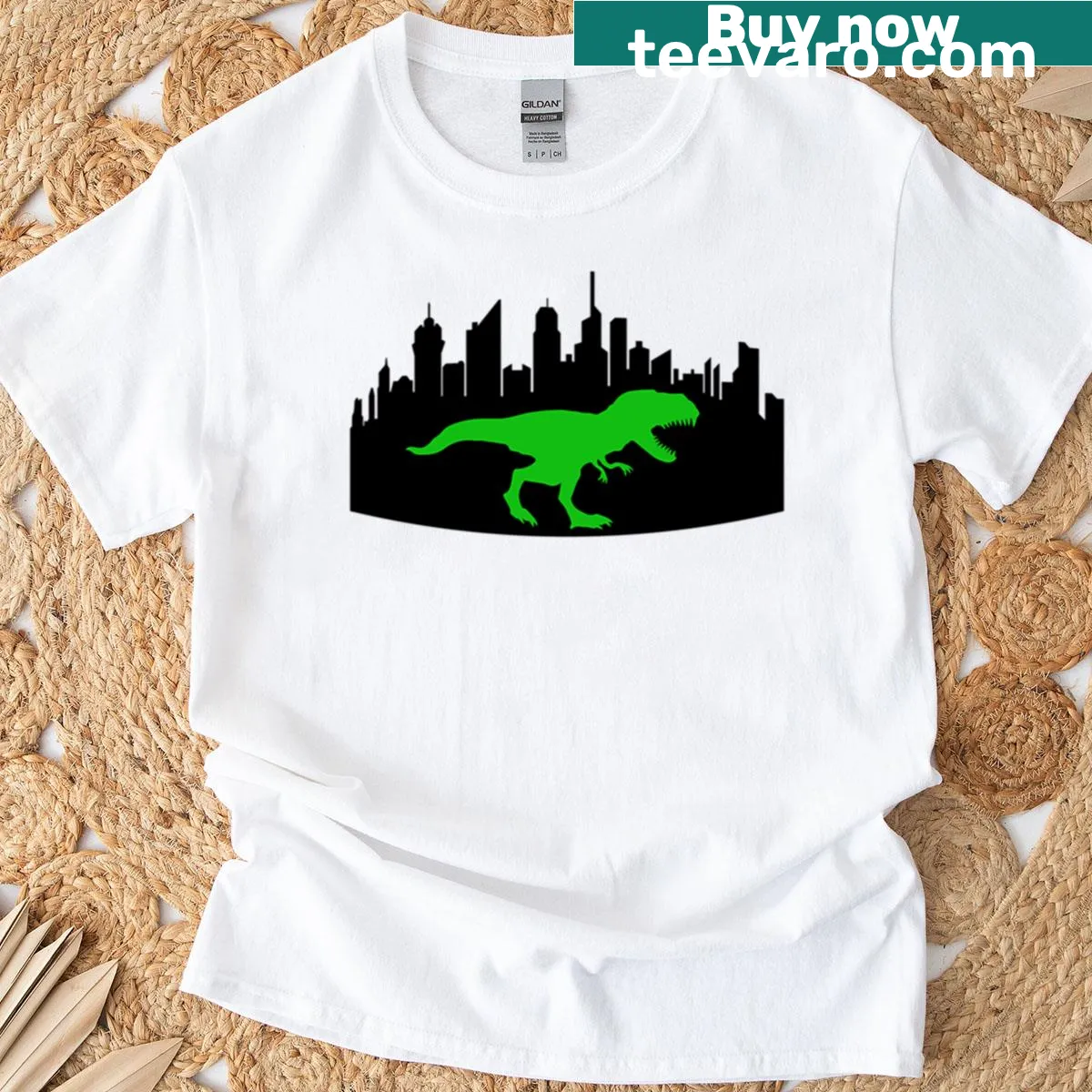Silhouette of a T-rex against a city skyline on a T-shirt — on a men's t-shirt