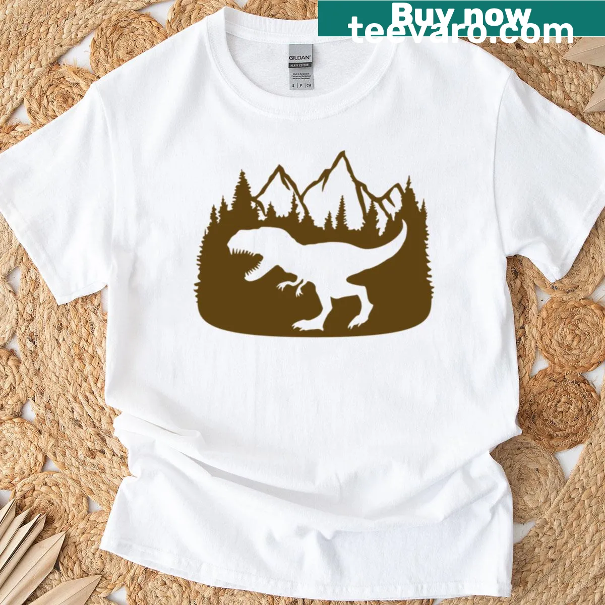 T-rex dinosaur design with mountains and trees on a T-shirt. — on a men's t-shirt