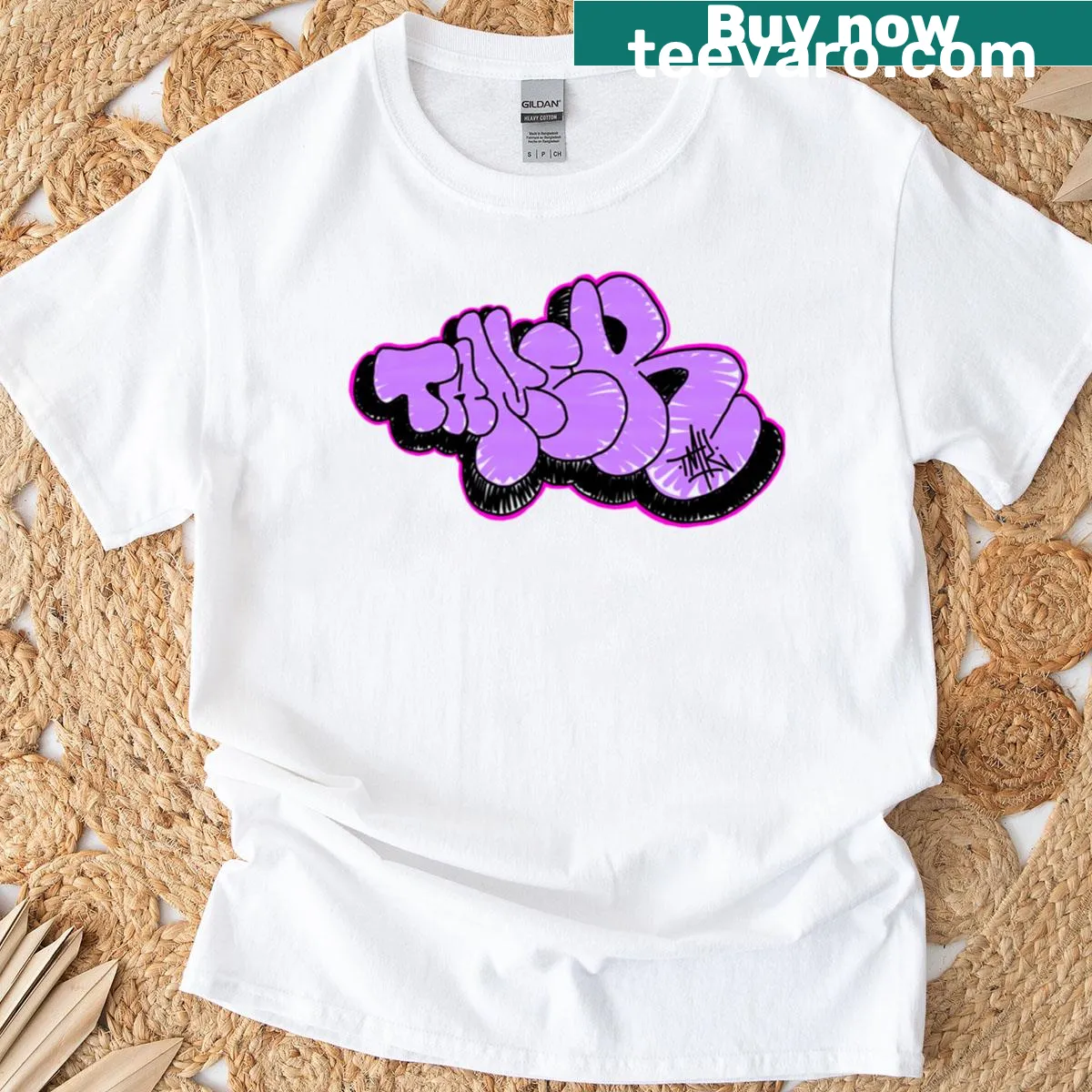 Playful cartoon T-shirt featuring a pink throwie inspired by street art — on a men's t-shirt