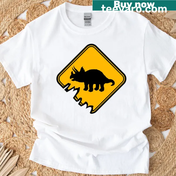T-shirt featuring a triceratops and warning sign graphic.