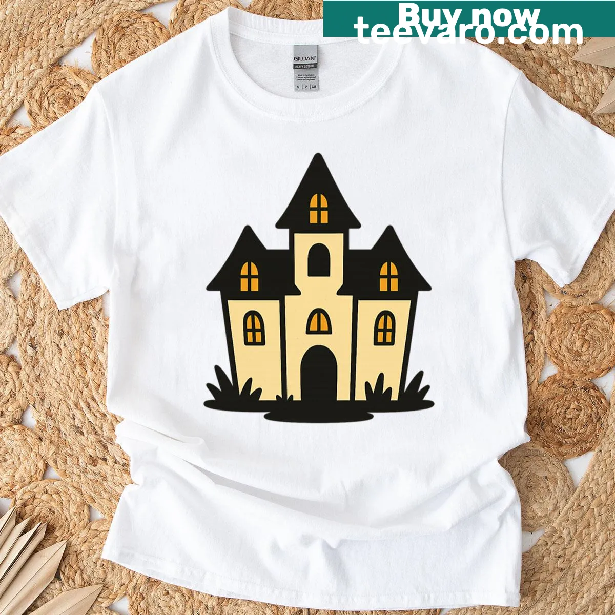 Whimsical haunted house illustration T-shirt with bats and clouds — on a men's t-shirt