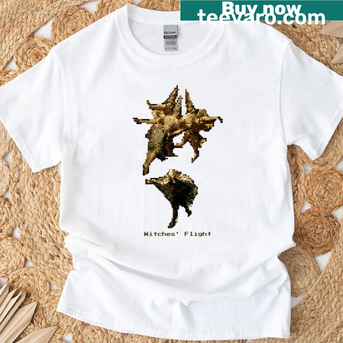 Graphic T-shirt with silhouette of witches flying against a moonlit sky — on a men's t-shirt