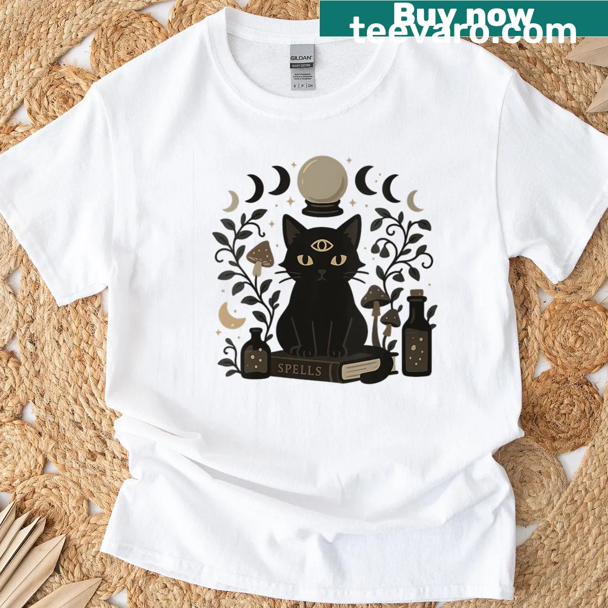 Occult-themed t-shirt with black cat and moon phases — on a men's t-shirt