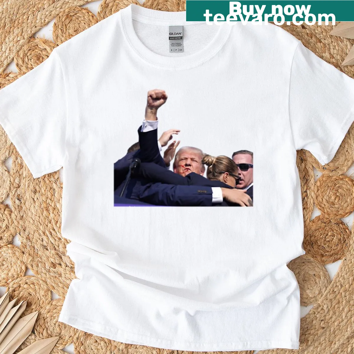 Bold typography with a fist graphic supporting Trump 2024 — on a men's t-shirt