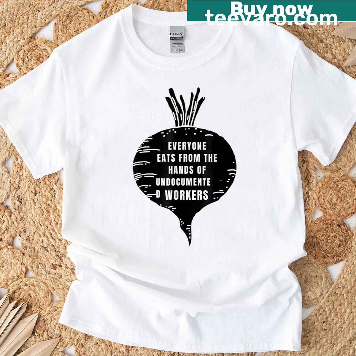 T-shirt featuring message about undocumented workers' contributions to society. — on a men's t-shirt