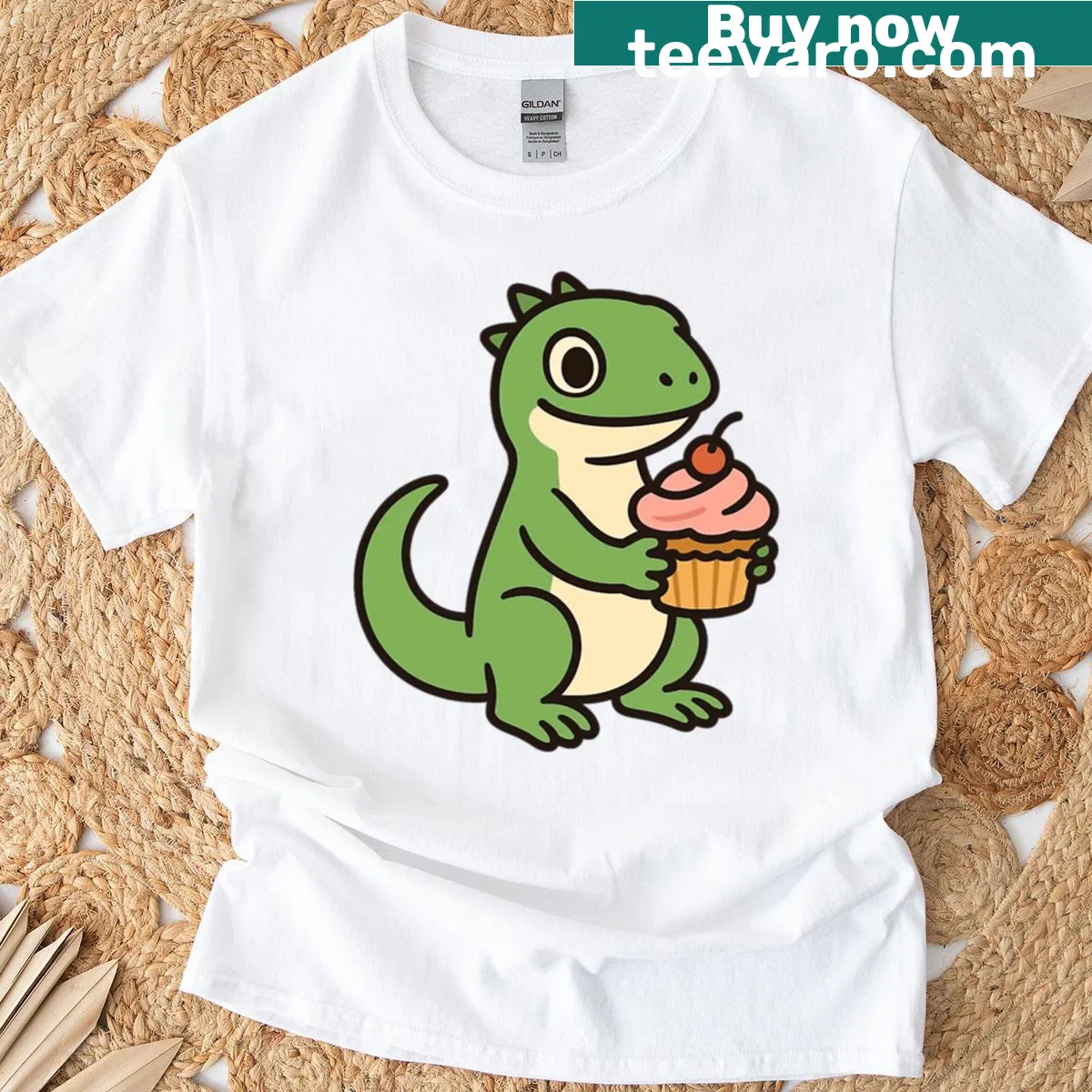 Cartoon lizard holding a cupcake t-shirt design — on a men's t-shirt