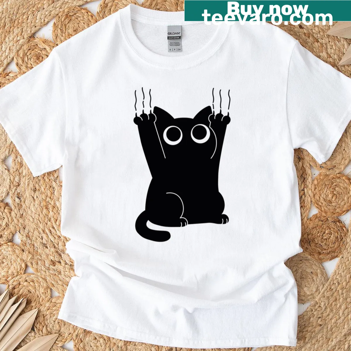 T-shirt with a cute cat illustration clawing for attention — on a men's t-shirt