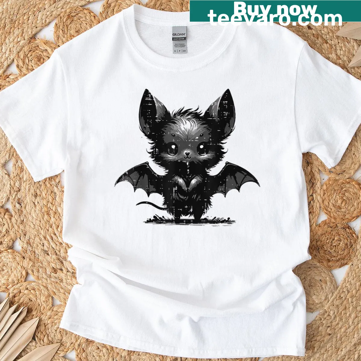 Halloween T-shirt featuring a whimsical bat graphic in a gothic style. — on a men's t-shirt