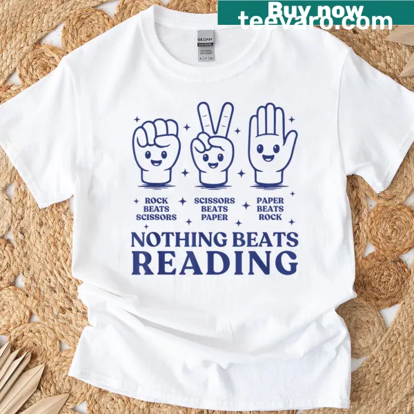 T-shirt with the phrase 'Nothing Beats Reading Rock Paper Scissors' in fun typography.