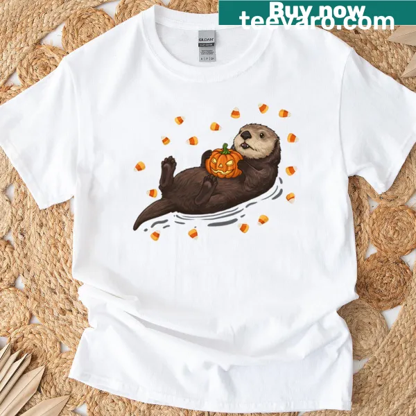Cute otter floating with a pumpkin for Halloween t-shirt