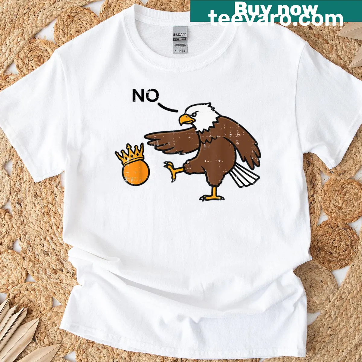 T-shirt with a bald eagle kicking a crown illustration — on a men's t-shirt