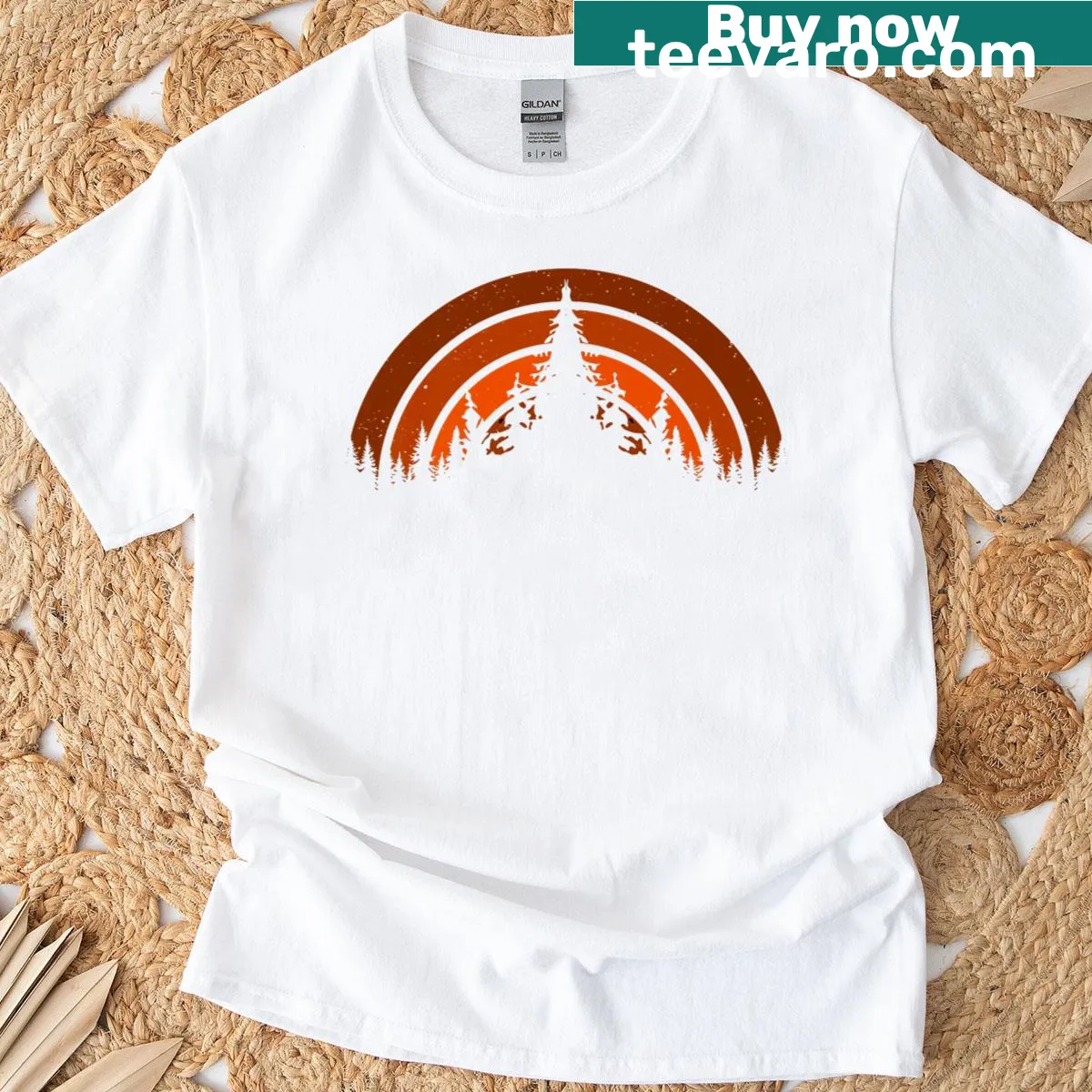 Vintage-style T-shirt featuring a sunset over a forest landscape — on a men's t-shirt