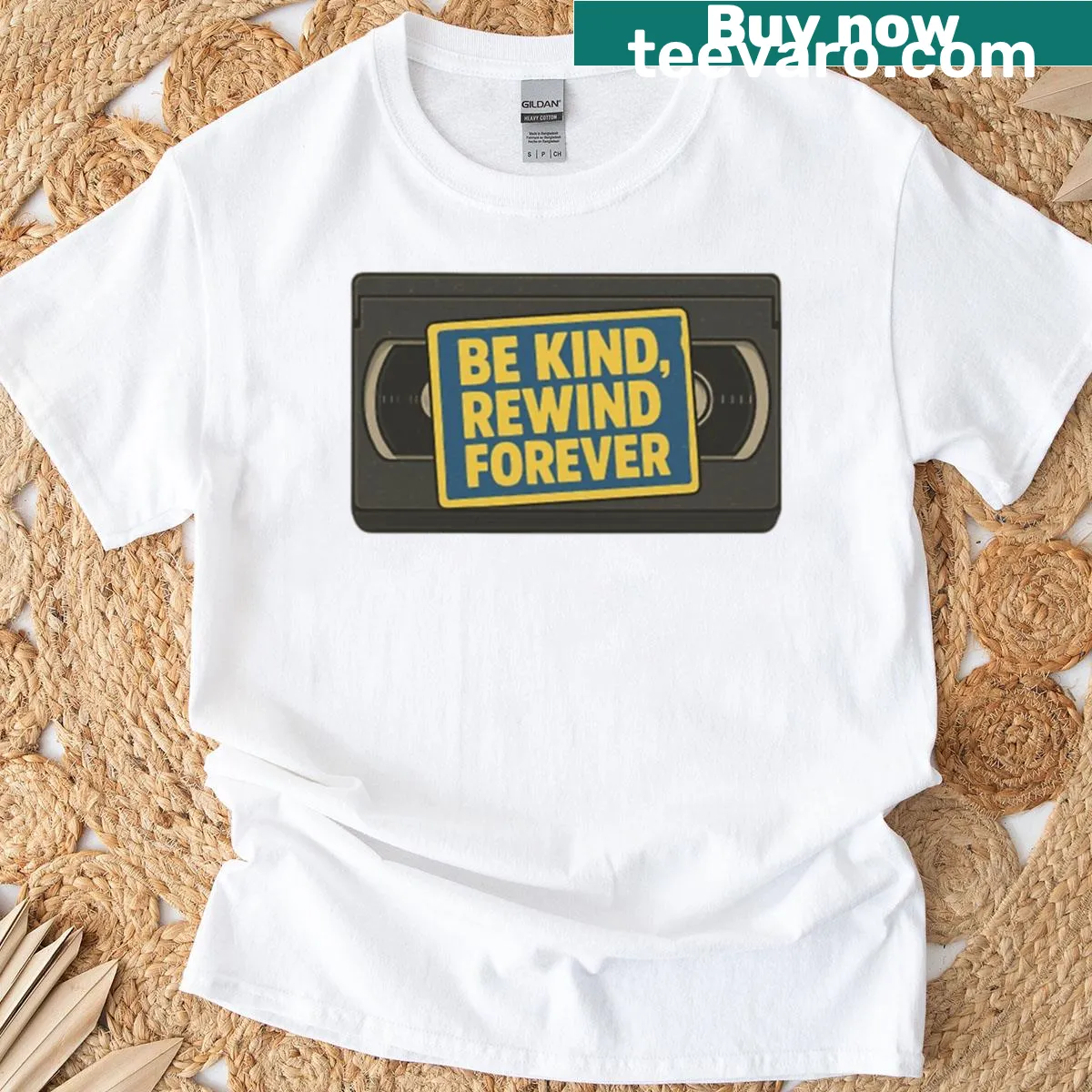 Retro VHS tape design t-shirt with Be Kind Rewind phrase — on a men's t-shirt