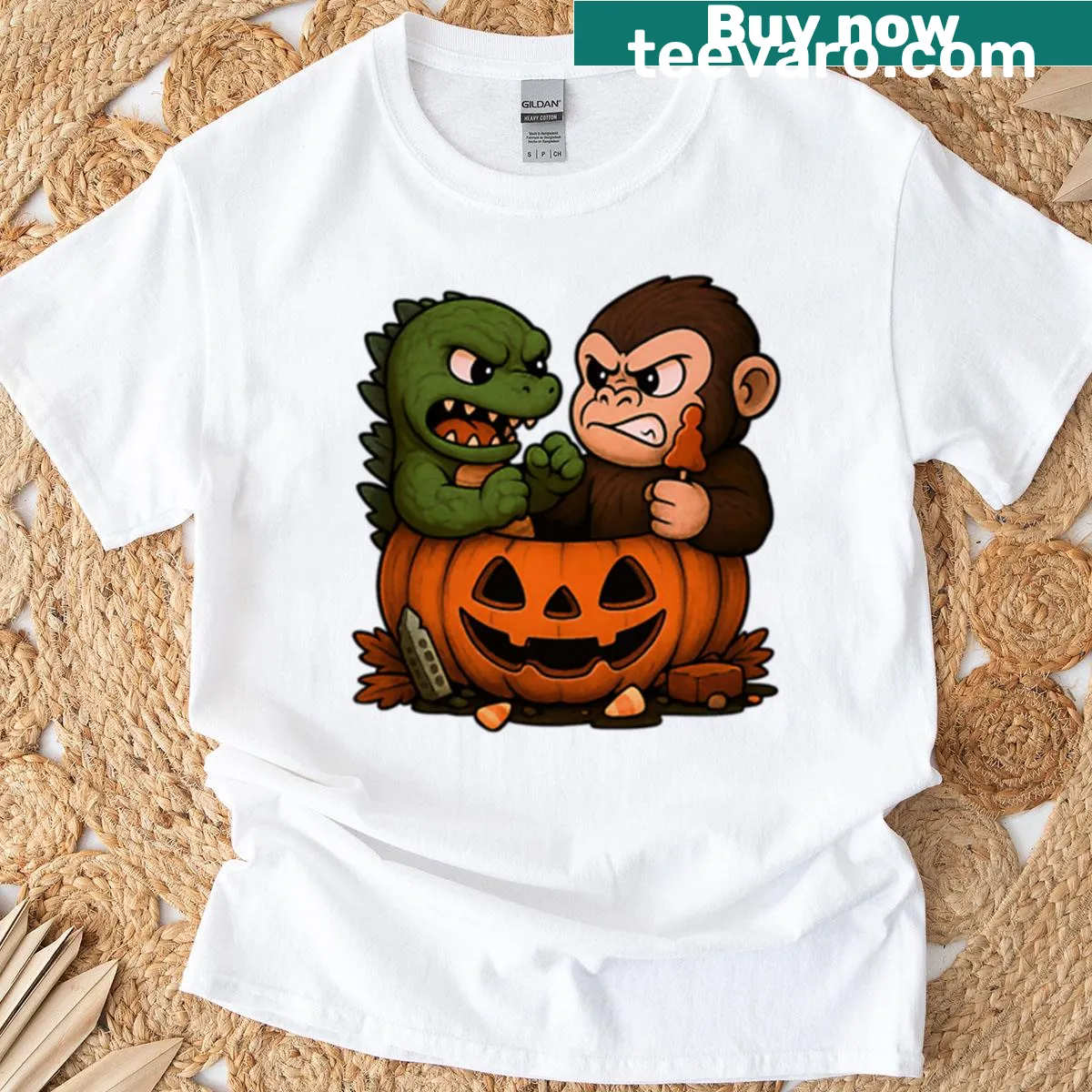 Graphic tee of King Kong vs Godzilla in a pumpkin for Halloween — on a men's t-shirt