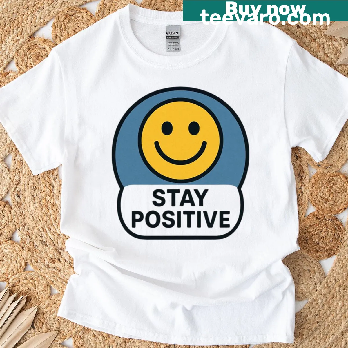 Inspirational 'Stay Positive' text on oversized T-shirt — on a men's t-shirt