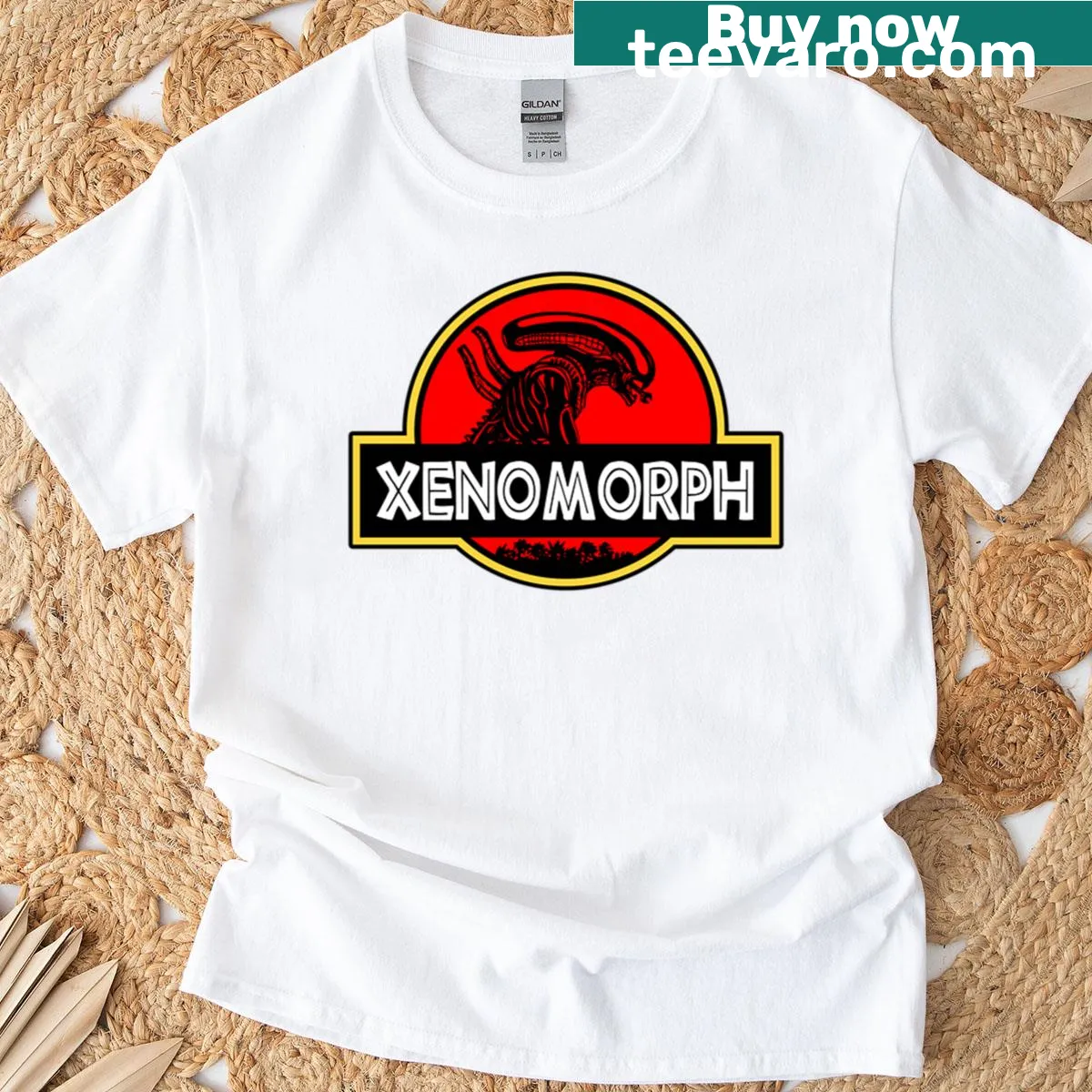 Xenomorph and Jurassic-themed logo T-shirt design — on a men's t-shirt