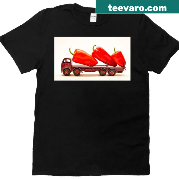 Oversized t-shirt featuring a truck filled with red hot peppers in a playful design.