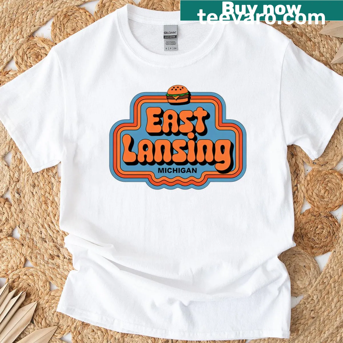 Vintage T-shirt featuring a retro burger design from East Lansing, Michigan — on a men's t-shirt