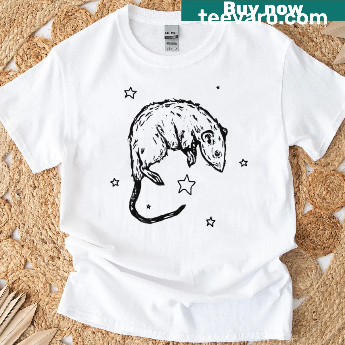 T-shirt depicting a whimsical rat surrounded by celestial elements — on a men's t-shirt