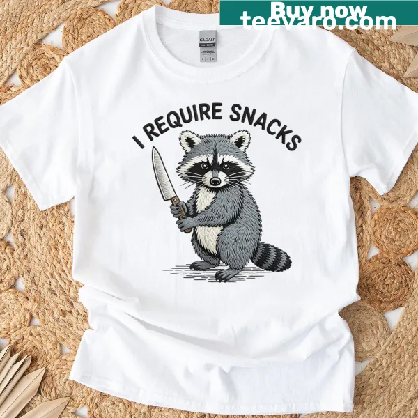 Funny T-shirt featuring a raccoon and 'I Require Snacks' text