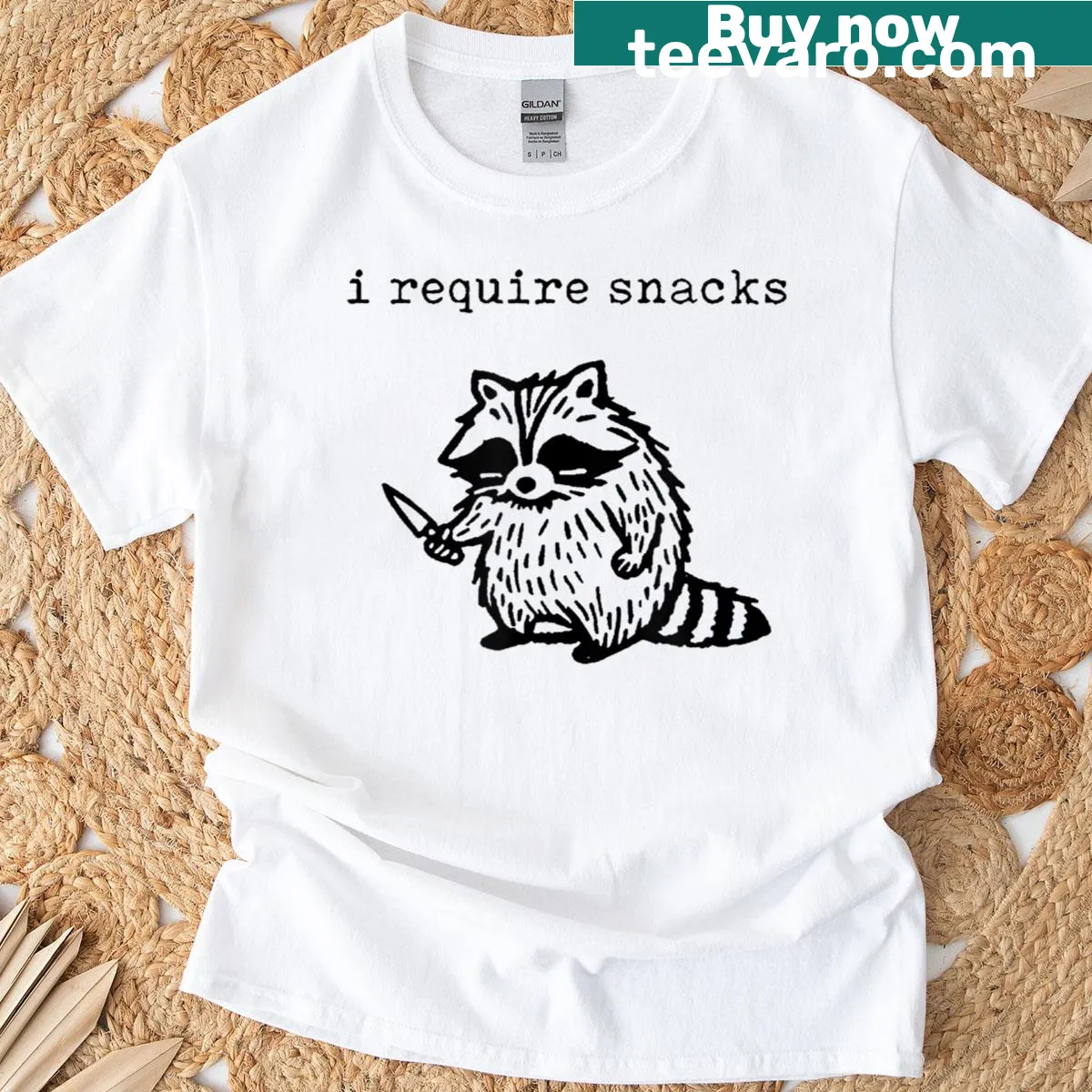 Whimsical raccoon illustration on I Require Snacks Tee — on a men's t-shirt