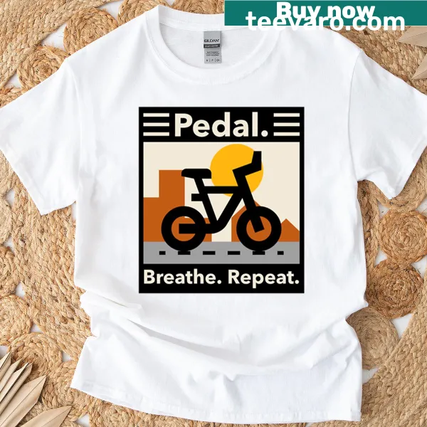 Motivational T-shirt with the phrase 'Pedal Breathe Repeat' in clean typography.