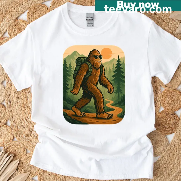 Whimsical t-shirt featuring an illustration of Sasquatch hiking in nature