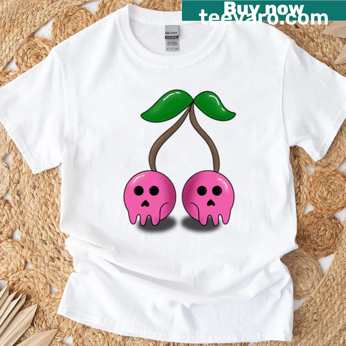 T-shirt featuring a skull and cherries graphic, blending whimsy with an edgy theme. — on a men's t-shirt