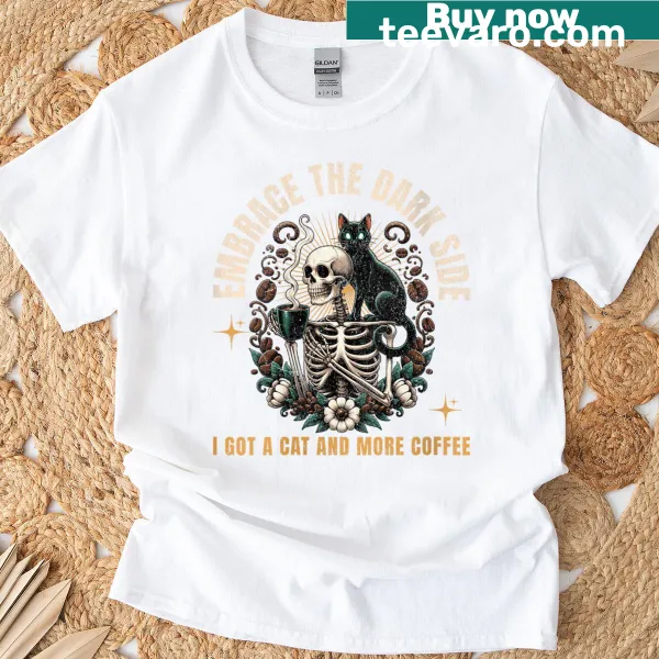 Halloween T-shirt with a skeleton, coffee, and cat illustration.