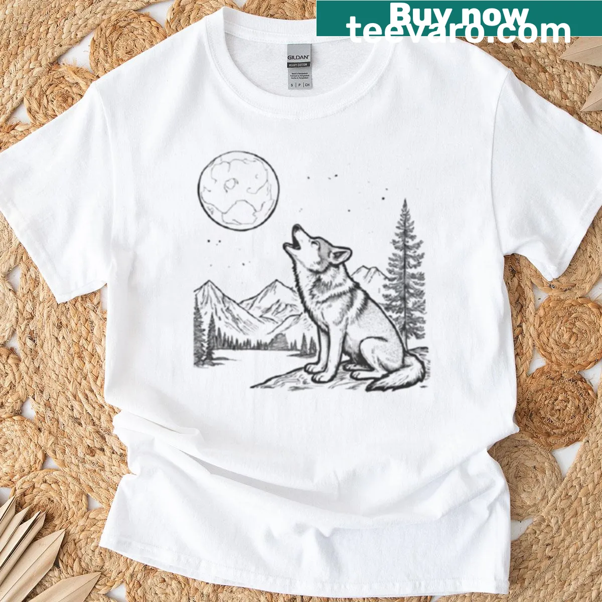 Wolf howling at the moon against mountains design on a t-shirt. — on a men's t-shirt